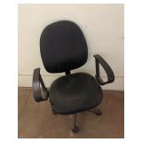 black faux leather rolling office chair