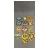 12 assorted police department patches