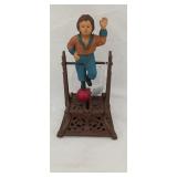 Reproduction cast iron bank of boy on trapeze
