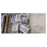 Partial and full bags of oil-dri quick sorb