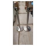 2 crowd control barriers on stands