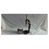 Vintage bottle cap press and box of bottle caps