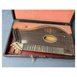 Antique zither is a stringed musical instrument