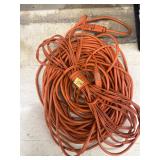 Two - Orange extension cords, unknown length