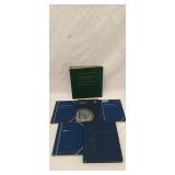 Assortment of coin collection books
