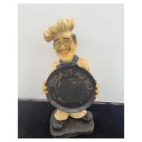 Chef statue with chalkboard menu