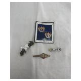Collection of military insignia pins
