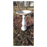 Plastic bird bath with weighted base 25' tall