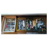 Large assortment of silverware knives,