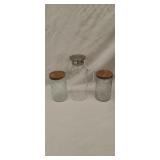 Glass pitcher 11' tall and two glass canisters