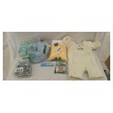 Assorted baby items new, sleepsuits, outlet plugs,