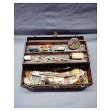 Vintage metal tackle box with fly lure materials