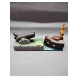 Cannon and ship themed cast iron coin bank