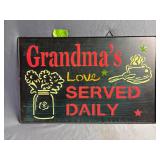 Grandma's love served daily metal sign
