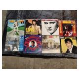 7 Elvis vinyl records and Elvis treasures book