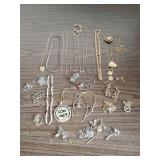Jewelry assortment including gold toned necklaces