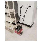 Small front tine tiller with Tecumseh motor