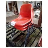 Stack of 3 fiberglass seat chairs