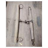 Two wooden single tree yokes