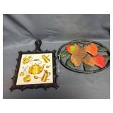 (2) Cast Iron Trivets - One has Tile Insert