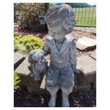 Concrete boy and dog statue 25' tall