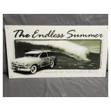 Metal Sign Featuring a Woody Station Wagon
