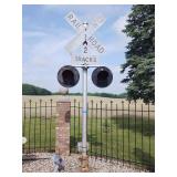 Vintage railroad crossing sign with lights