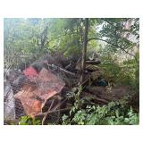 Scrap Metal piles behind Barn