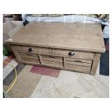 Wood coffee table with top storage and three pull