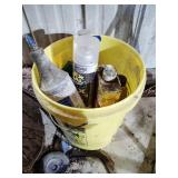 Bucket of assorted spays and lubricants and