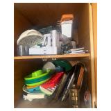 Contents of Cabinet, pans, ice cube trays,