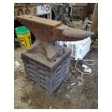 Large Fisher 1911 anvil with cribbed wood base