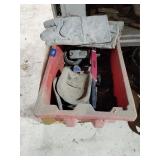Plastic tote, hacksaw, gloves, caster wheel, misc