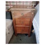 Vintage wood nightstand has some wear
