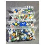 (4) Bags of Marbles Including Clay