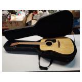 Washburn acoustic guitar in case needs repair