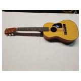 Harmony acoustic guitar missing one string