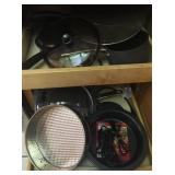 Contents of Cabinet Right of Stove Pans & Baking