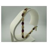 14K Gold Ruby and Opal Bracelet $26k