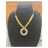 Beaded Necklace with Circular Metal Pendant