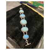 Silver Bracelet with Blue Oval Cabochon Stones