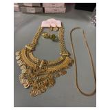 2 rings, 2 necklaces, & set of earrings