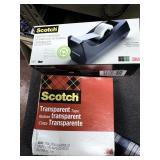 scotch tape dispenser and 1 large roll transparent