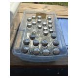 28 empty salt or pepper shakers, tote with lid