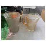 2 glass water pitchers,