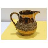 A Lusterware Ceramic Creamer