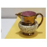 A Lusterware Ceramic Creamer