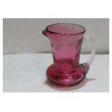 A Small Cranberry Glass Pitcher