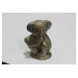 A Miniature Pewter Bear