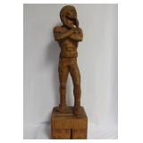 A Wood Statue of a Native American Man